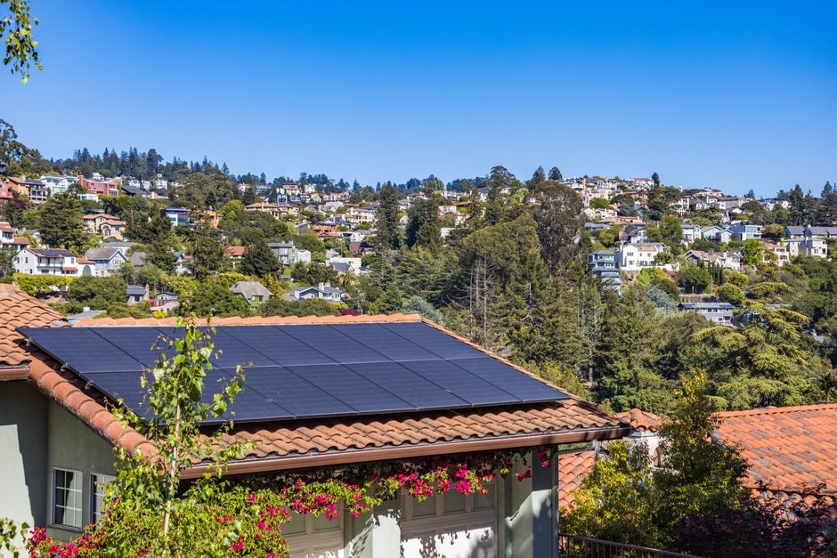 Modern residential solar panels installed on a roof